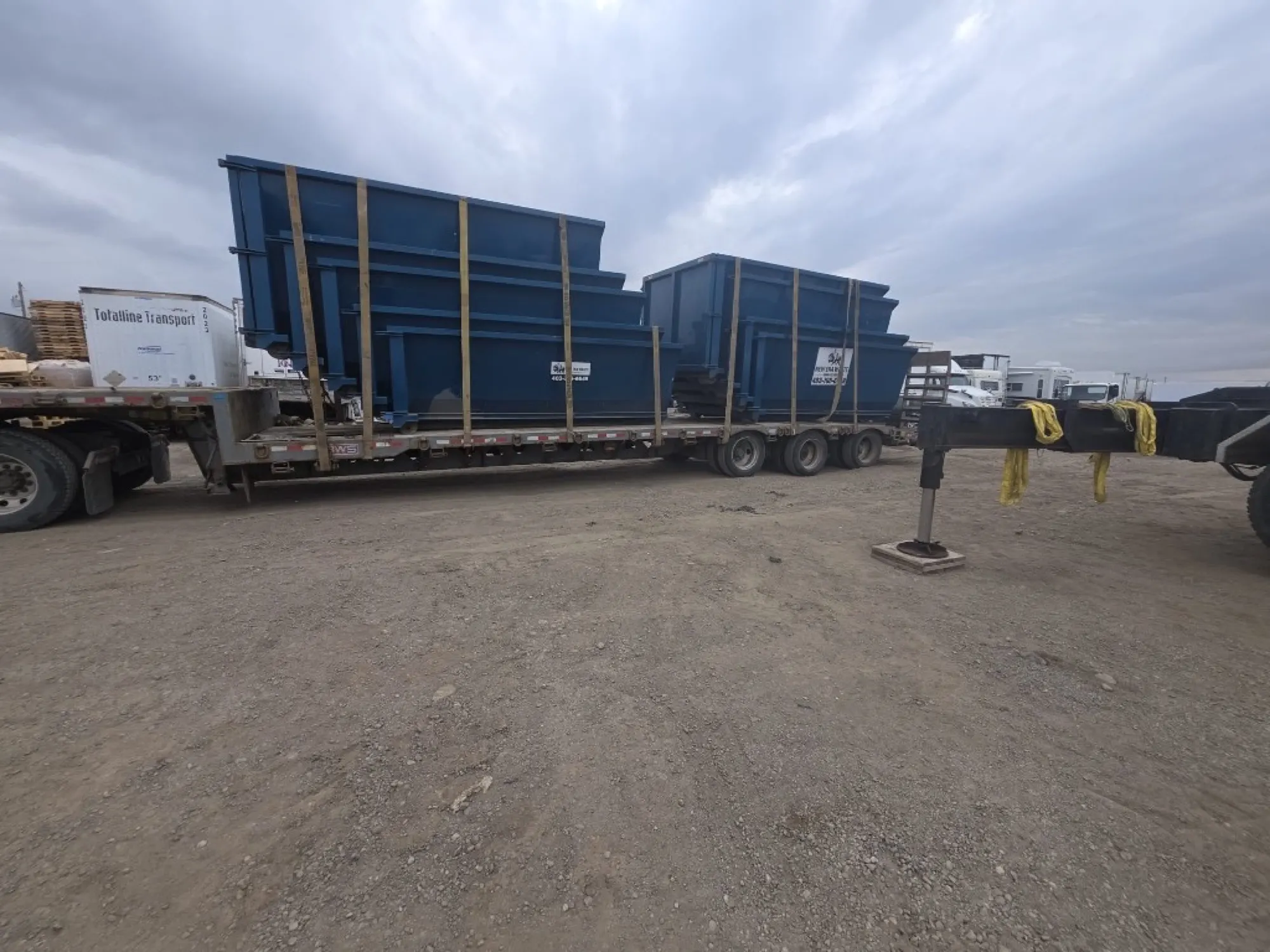 Roll-off dumpsters on a trailer ready for Edmonton delivery